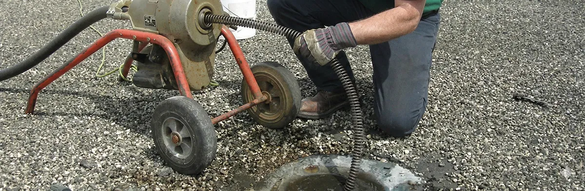 sewer rodding technician actively removing blockages from a sewer line in Ogden, UT